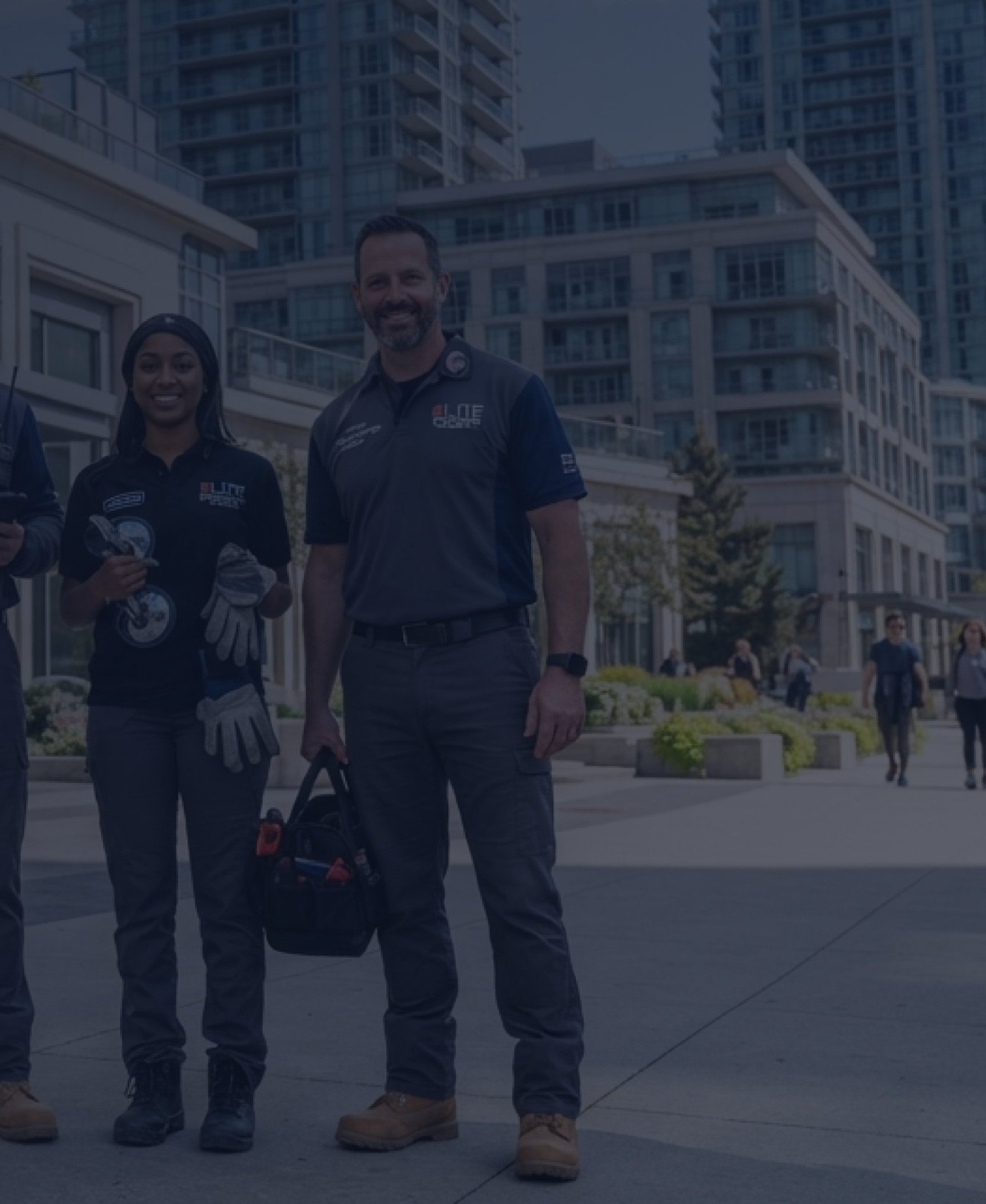 The Quick Replace team standing outside a commercial building