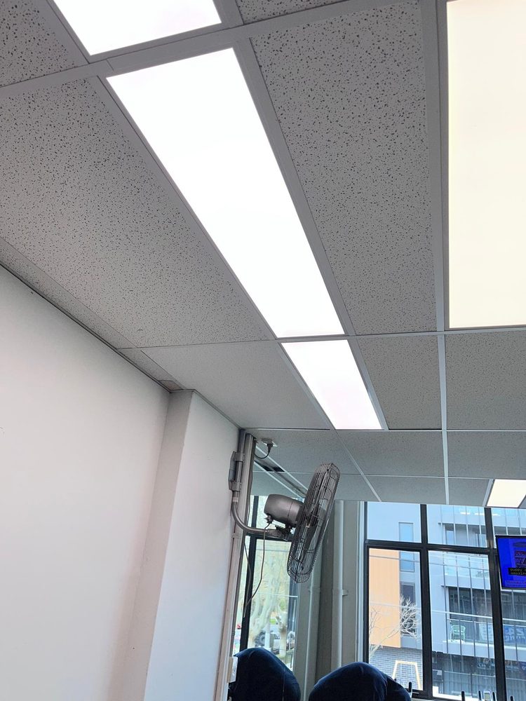 New LED panel lights in an office suspended ceiling