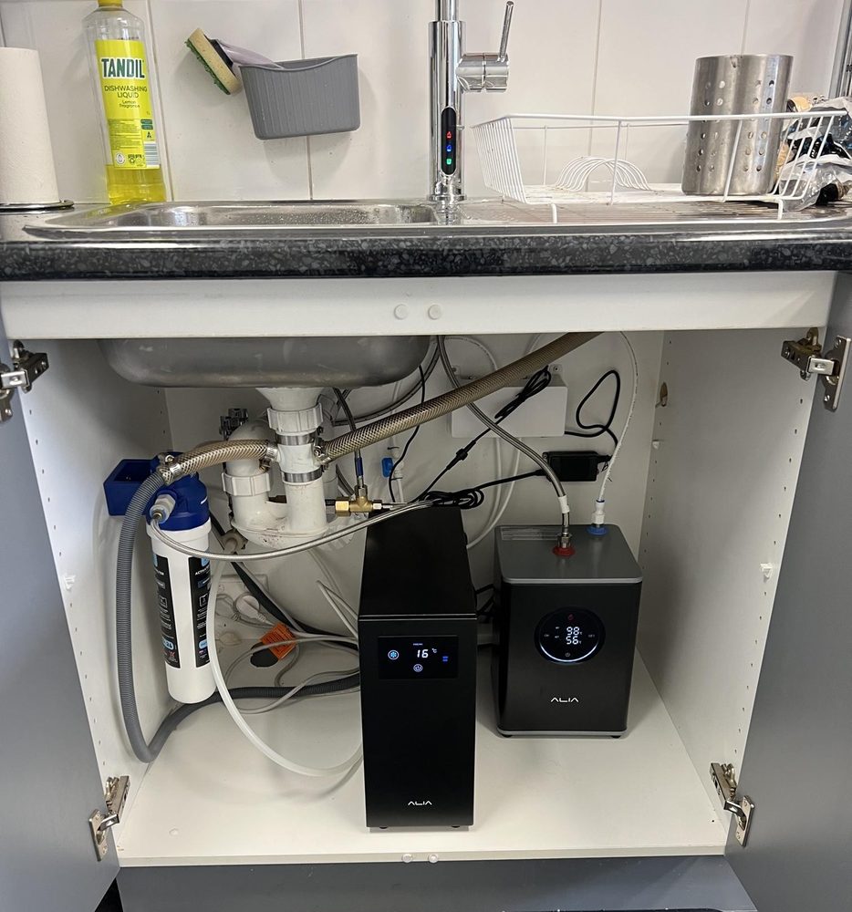 Boiling and chilled filtered water units installed under a kitchen sink