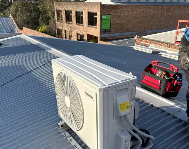 Split system outdoor unit installed on a metal roof