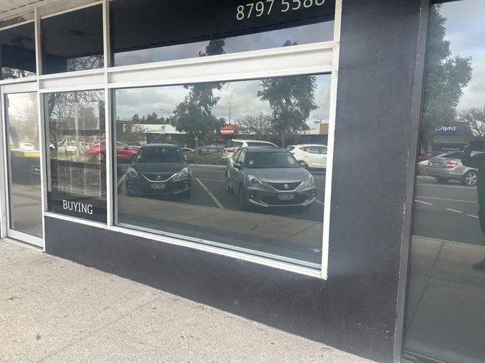 Replaced shopfront window with reflective glass
