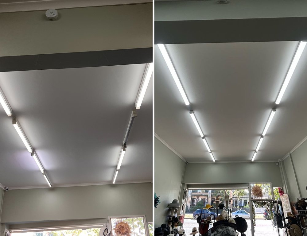 Dim fluorescent ceiling lights beside the replaced, brighter lights