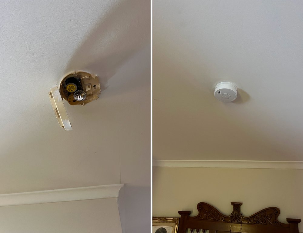 Broken smoke alarm base on a ceiling beside the new smoke alarm